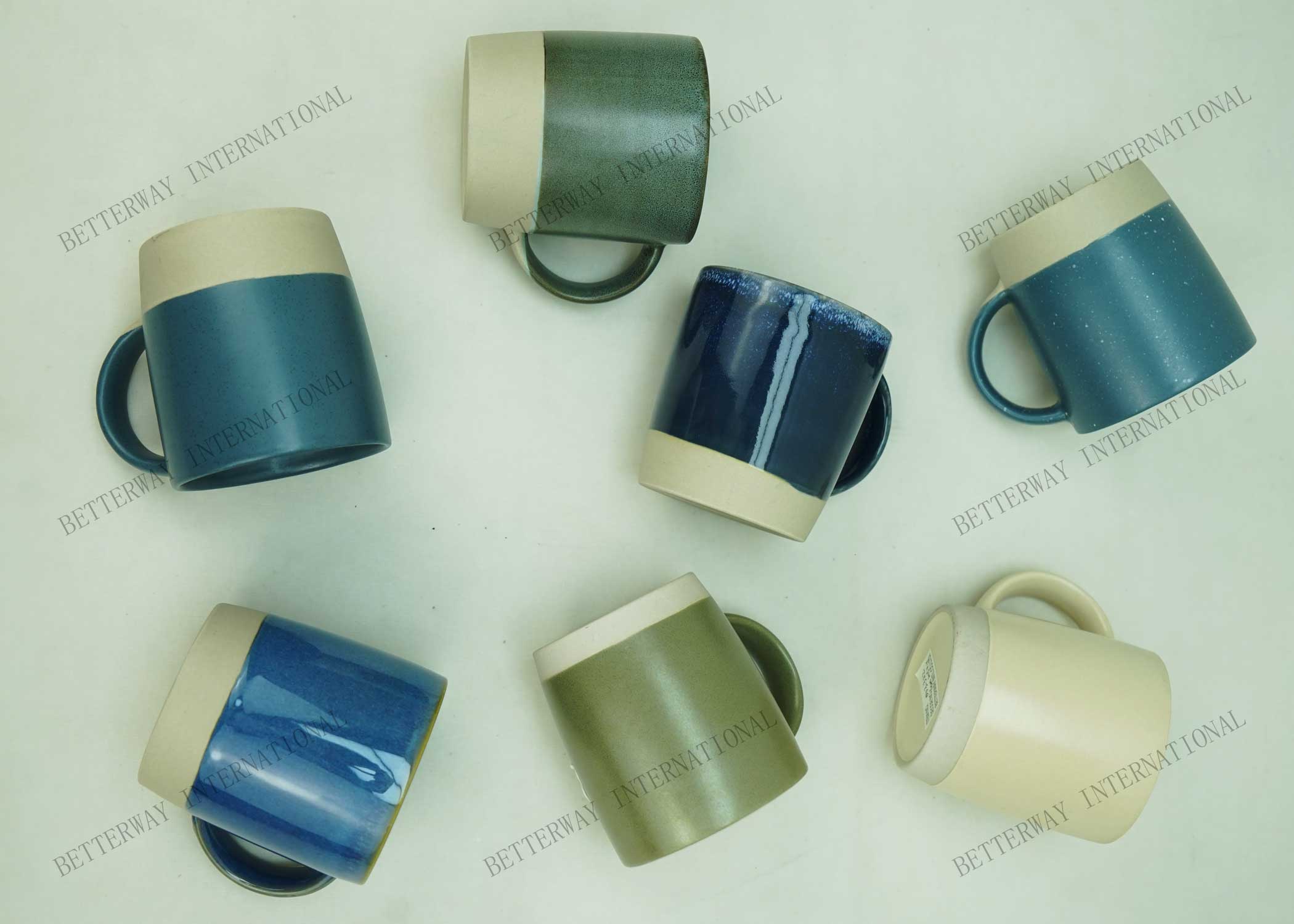 Stoneware coffee mug reactive glaze on top with matte stone bottom